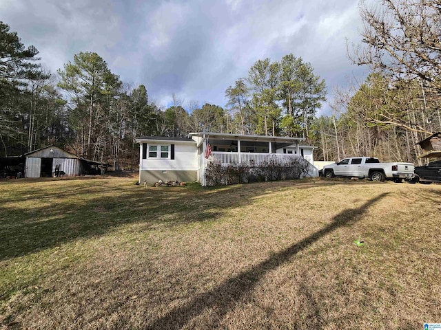 view of front facade with a front lawn and a porch