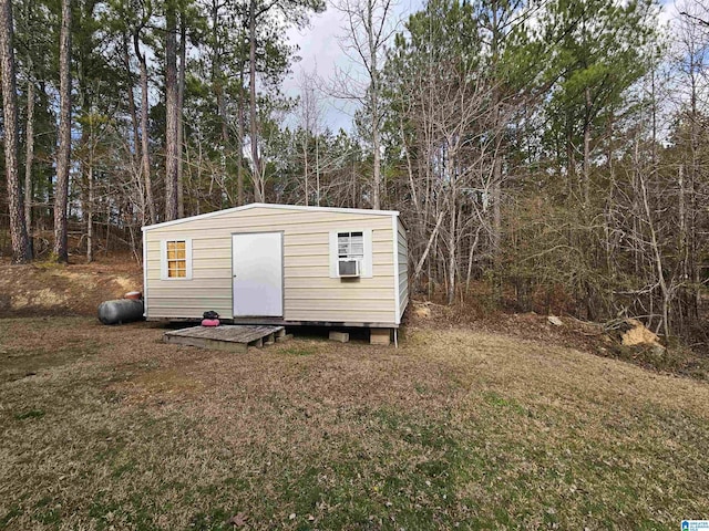 view of outbuilding with a lawn