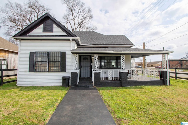 view of front of property with a porch and a front yard