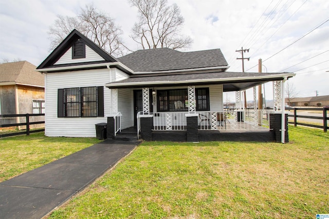 view of front of property with a porch and a front yard