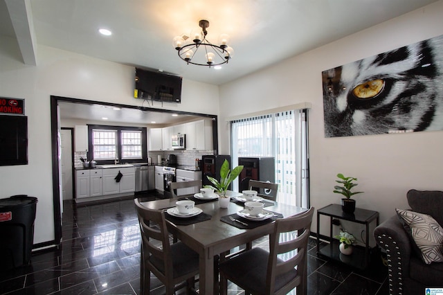 dining area featuring a chandelier