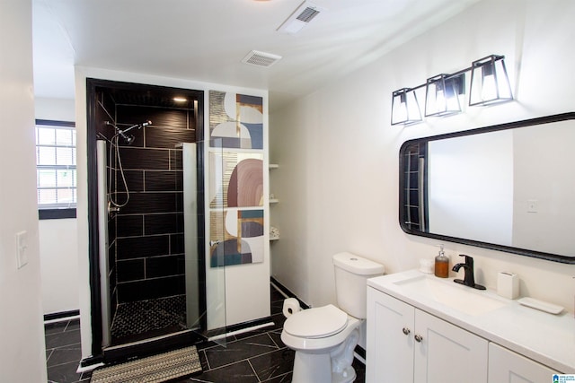 bathroom featuring walk in shower, vanity, and toilet