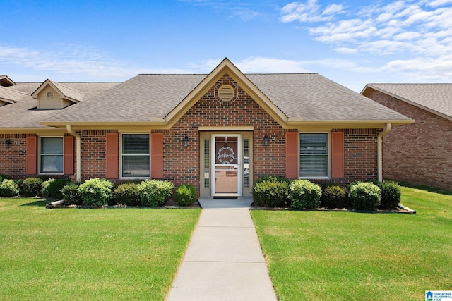 ranch-style home with a front lawn