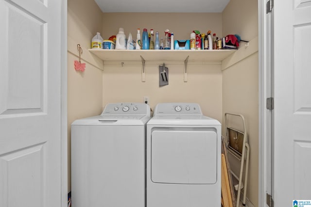 laundry area with washing machine and dryer