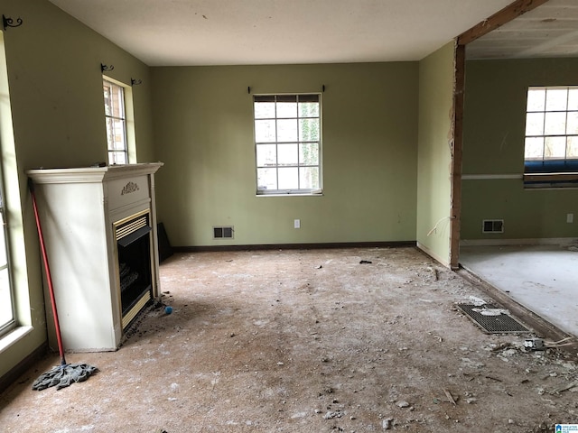 unfurnished living room with a healthy amount of sunlight