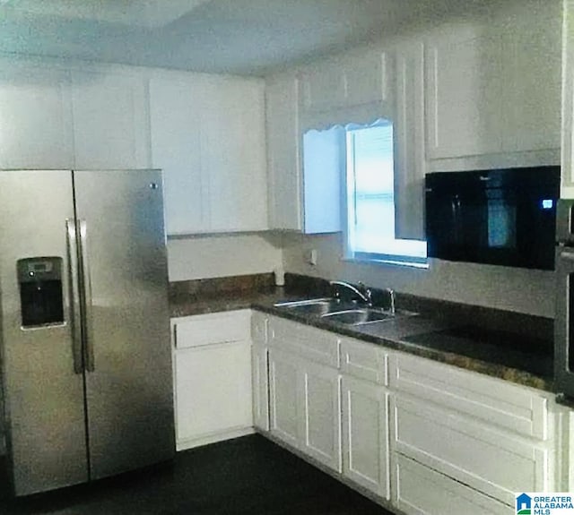 kitchen with black electric stovetop, sink, stainless steel fridge with ice dispenser, and white cabinets