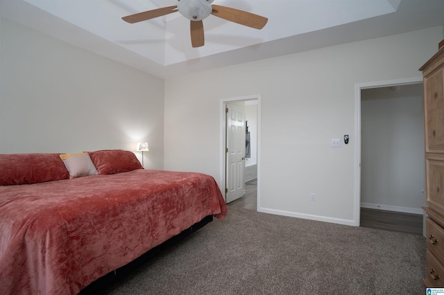 carpeted bedroom with ceiling fan and ensuite bathroom