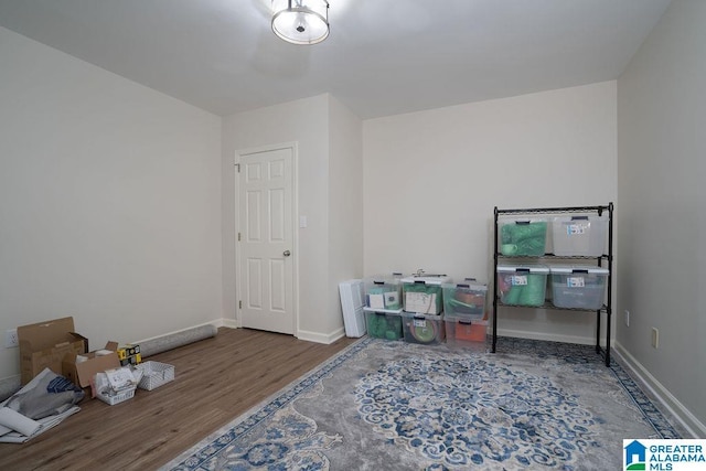 game room with dark hardwood / wood-style floors