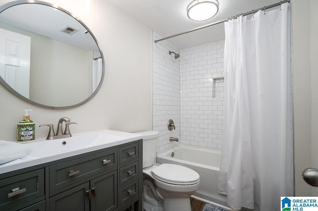 full bathroom featuring vanity, toilet, and shower / bath combo with shower curtain