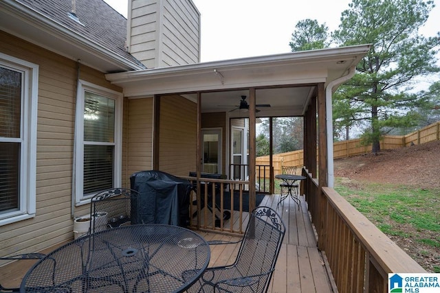 deck featuring grilling area and ceiling fan