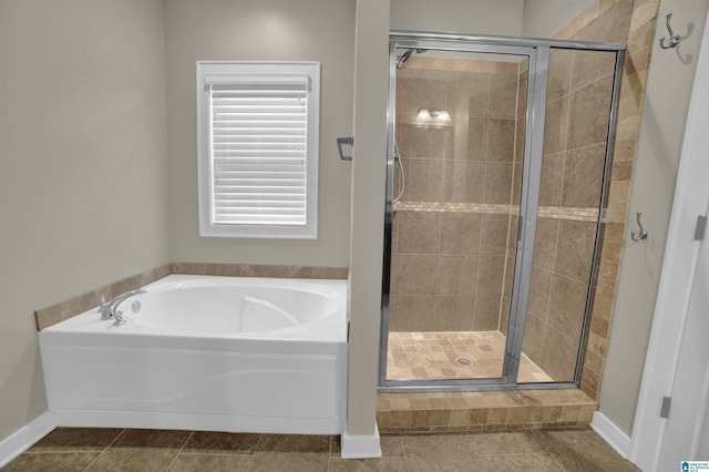 bathroom with tile patterned flooring and separate shower and tub