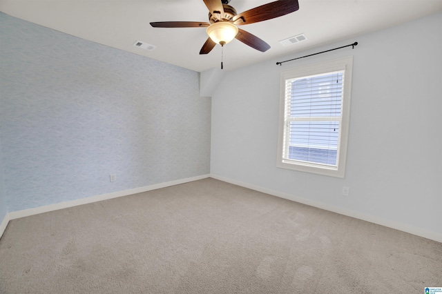 unfurnished room featuring carpet floors and ceiling fan