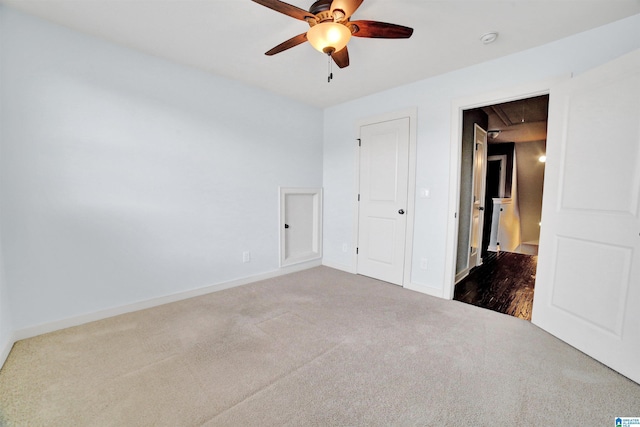 unfurnished bedroom featuring carpet flooring and ceiling fan