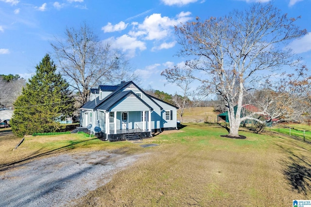 view of property exterior with a yard and covered porch