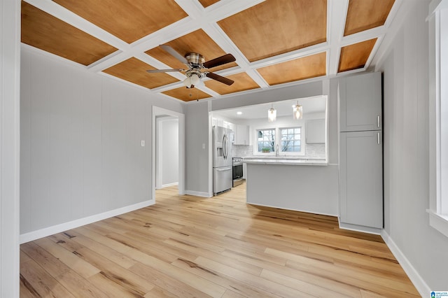 unfurnished living room with coffered ceiling, ceiling fan, and light wood-type flooring