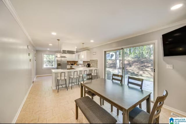 dining area featuring ornamental molding