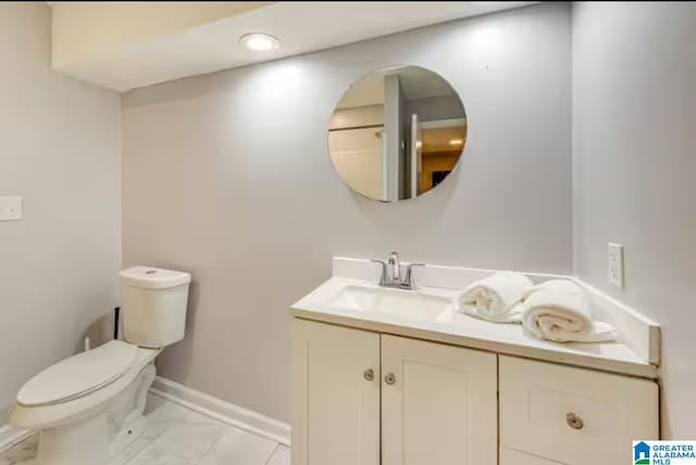 bathroom featuring vanity and toilet