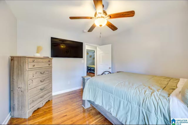 bedroom with ceiling fan and wood-type flooring