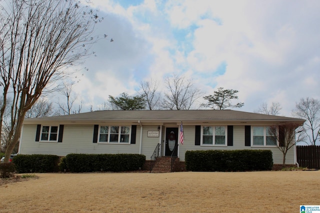 ranch-style house with a front lawn