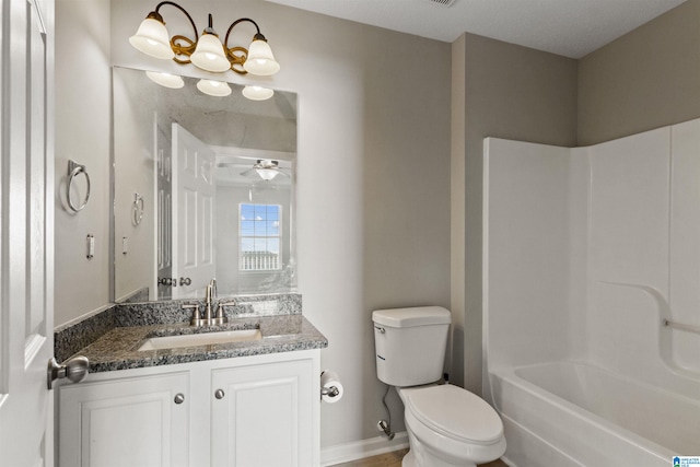 full bathroom with vanity, washtub / shower combination, ceiling fan, and toilet