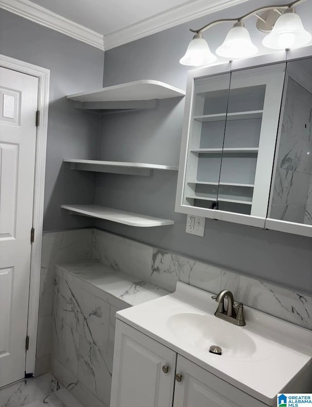 bathroom featuring vanity and ornamental molding