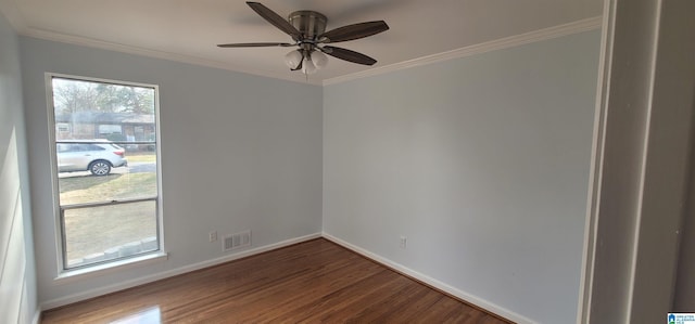 empty room featuring wood-type flooring, ornamental molding, and ceiling fan