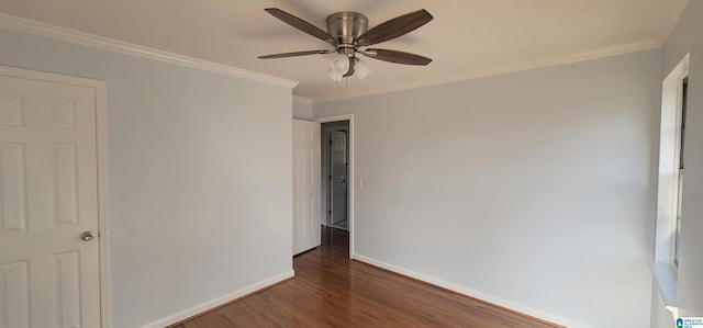 unfurnished bedroom featuring dark hardwood / wood-style flooring, crown molding, and ceiling fan