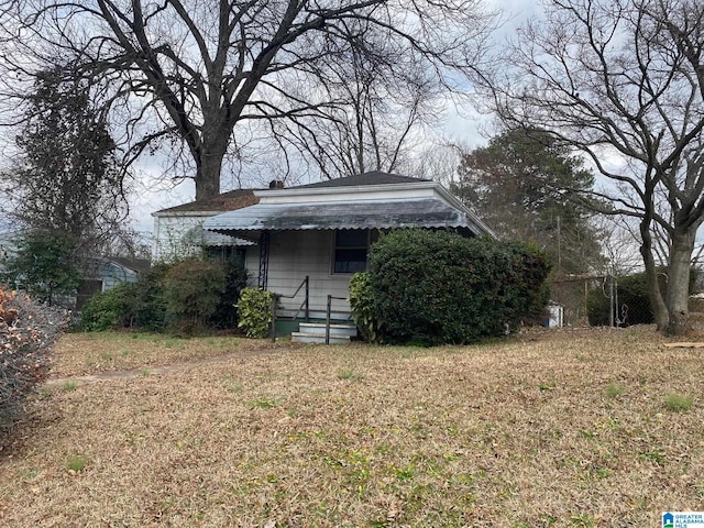 view of home's exterior with a yard