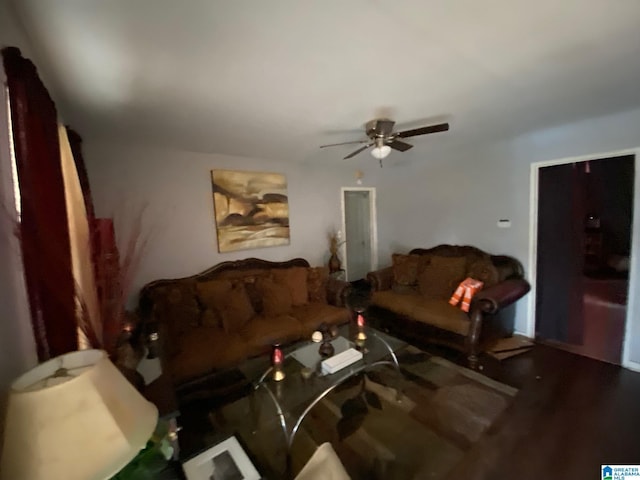 living room featuring hardwood / wood-style floors and ceiling fan