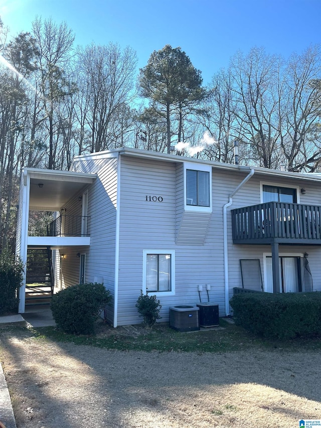 view of home's exterior featuring a balcony and cooling unit