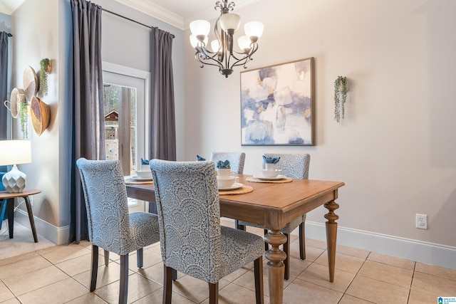 tiled dining room with ornamental molding and a chandelier