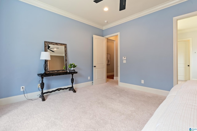 bedroom with crown molding, light colored carpet, and ceiling fan