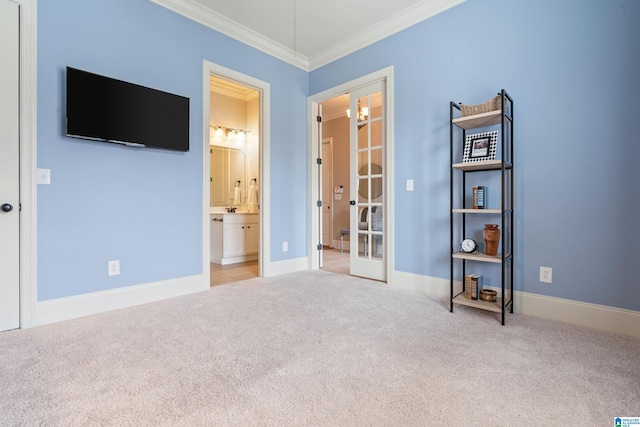 unfurnished bedroom with crown molding, light carpet, ensuite bath, and french doors