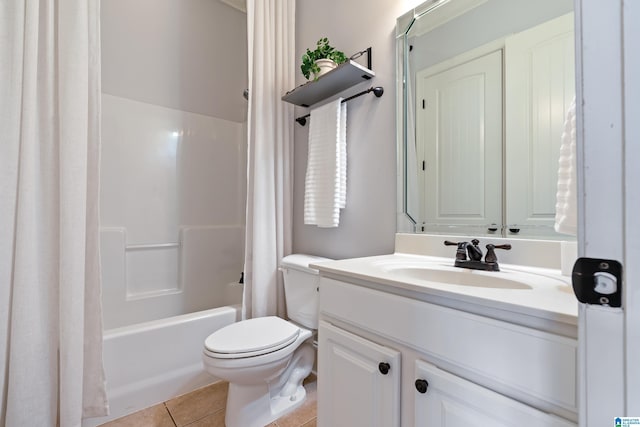 full bathroom featuring vanity, tile patterned floors, shower / bath combo with shower curtain, and toilet