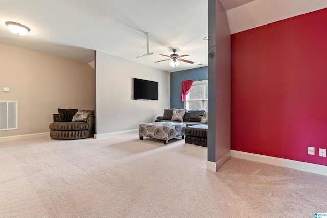 interior space with carpet flooring and ceiling fan