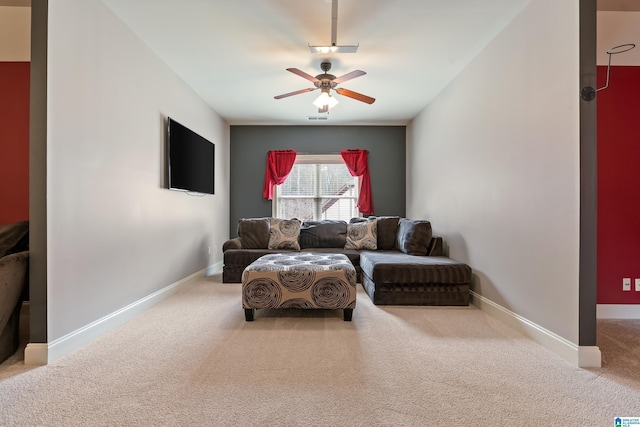 sitting room featuring ceiling fan and carpet flooring