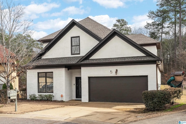 view of front of property with a garage and a playground