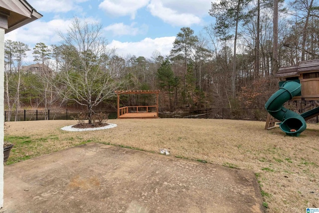 view of yard featuring a playground and a patio area