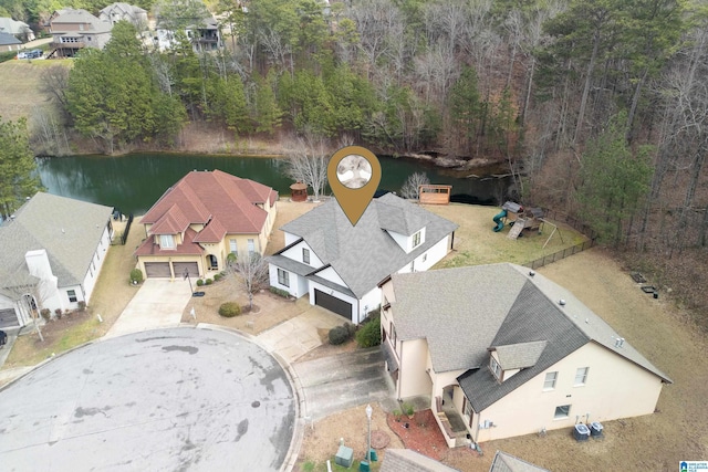 birds eye view of property featuring a water view