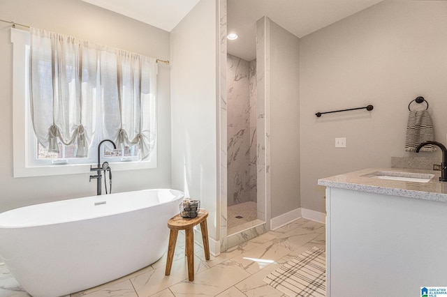 full bathroom with marble finish floor, a freestanding tub, a marble finish shower, and baseboards