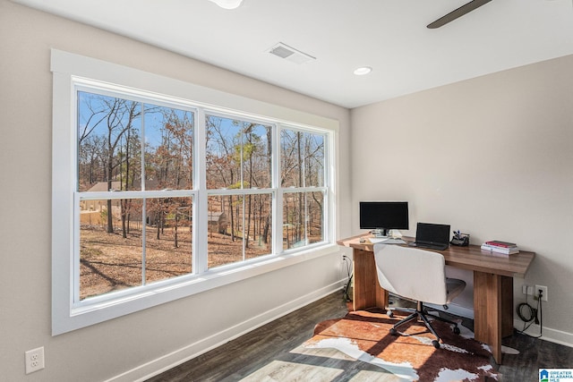 home office featuring recessed lighting, dark wood finished floors, visible vents, and baseboards