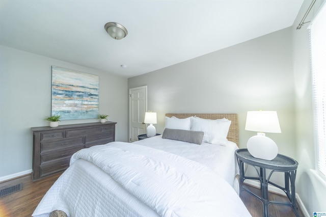 bedroom featuring dark hardwood / wood-style flooring