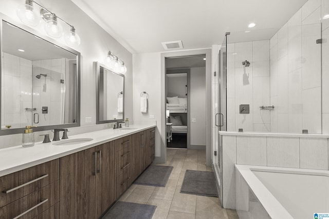 1150 8th St Unit 503, Tuscaloosa, AL 35401 - bathroom featuring walk in shower, tile patterned floors, and vanity
