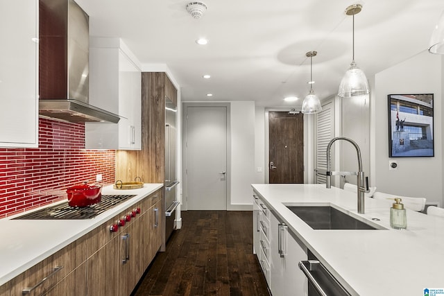 1150 8th St Unit 503, Tuscaloosa, AL 35401 - kitchen featuring wall chimney exhaust hood, sink, gas stovetop, dark hardwood / wood-style floors, and backsplash