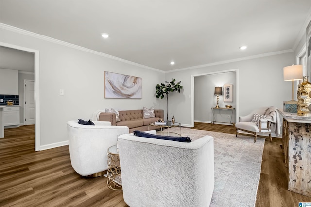 living room with dark wood-type flooring and ornamental molding