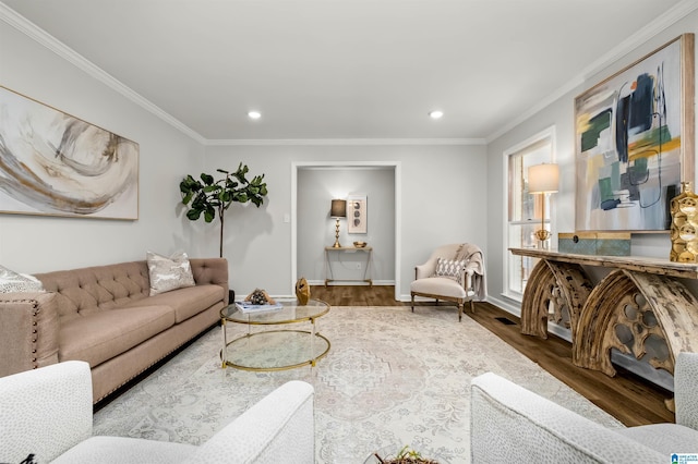 living room featuring ornamental molding and hardwood / wood-style floors