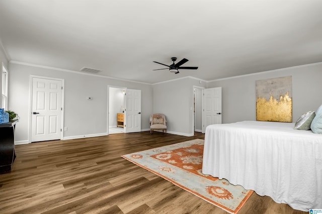 bedroom with hardwood / wood-style flooring, ornamental molding, and ceiling fan