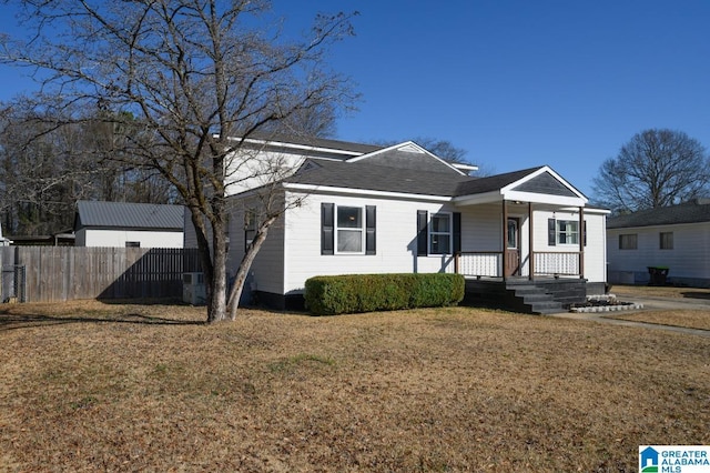 view of front facade with a front lawn and covered porch