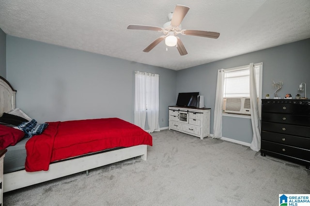 carpeted bedroom featuring cooling unit, ceiling fan, and a textured ceiling