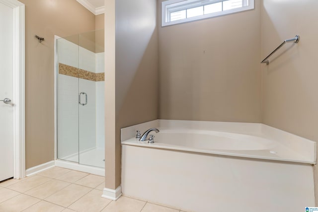 bathroom with ornamental molding, separate shower and tub, and tile patterned floors